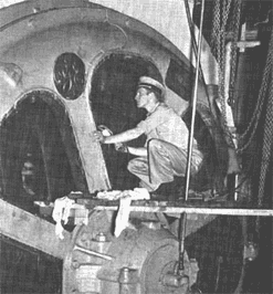 Engine cadet inspecting a ship's electric motor