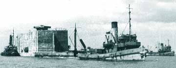 Tugs positioning a Phoenix at Normandy