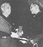 Georgia Brown Henry receives the Mariner's Medal for son Alphonso A. Henry, Jr