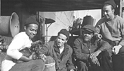 Crew of SS Booker T. Washington with mascot "Booker" 