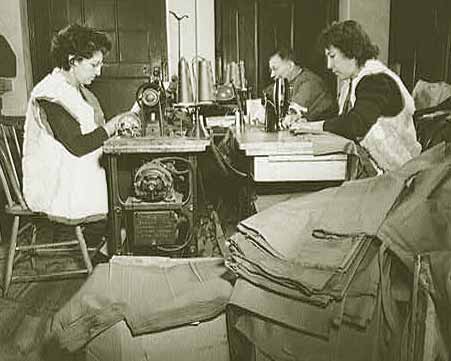 Workers stitching heavy cotton exterior of vests